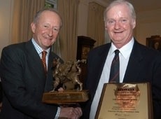 Michael Turner (L) hands over award to Gerry O'Brien