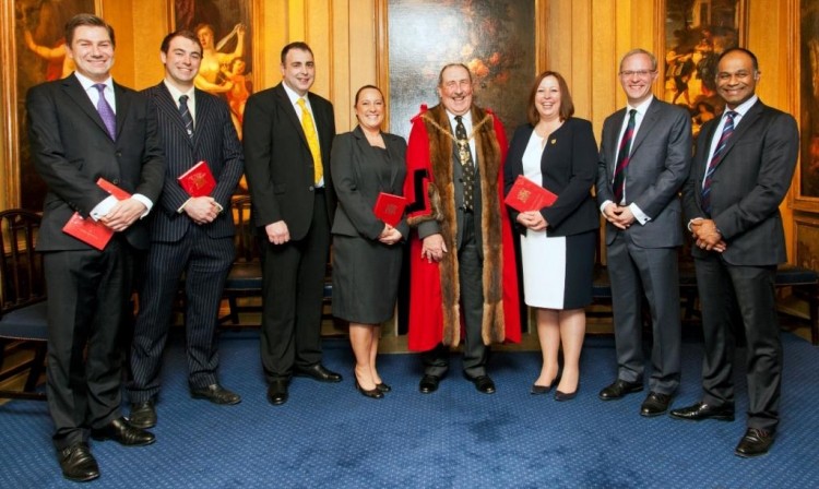 T & R Theakston cooper Jonathan Manby (third from left) after being invested into the livery by Ian Frood, Master of the Worshipful Company of Coopers