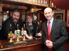 John Healey with Dave and Cath Bannister, licensees at the Squirrel in Stevenage