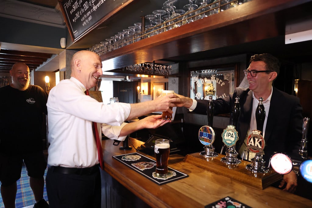 23/07/2026. Harlow, United Kingdom. Prime Minister Andy Burnham and Chancellor of the Exchequer John Healey visit the Hare pub as the government announces a 20 percent cut in business rates for pubs, clubs and live music venues. Picture by Simon Dawson / No 10 Downing Street
