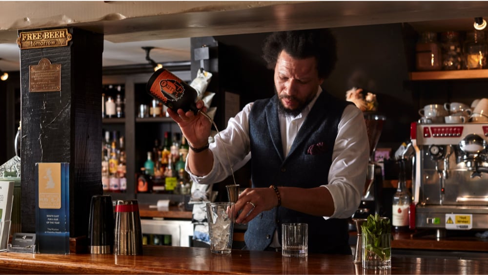 The Mutton Bar Anthony Peart making rum cocktail