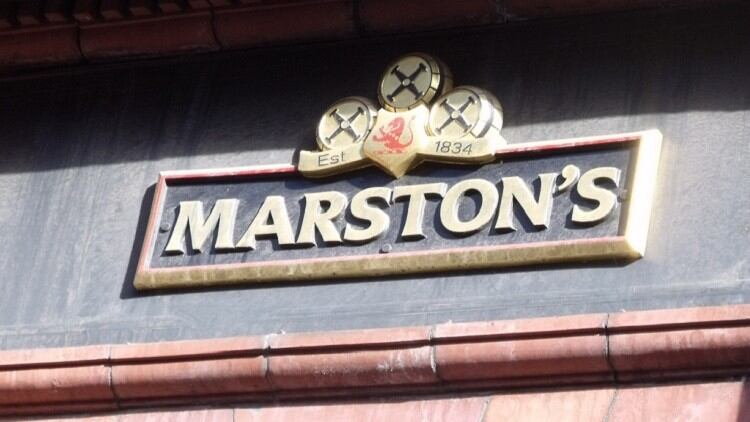 Marston's profits drop as debt reduction pursued