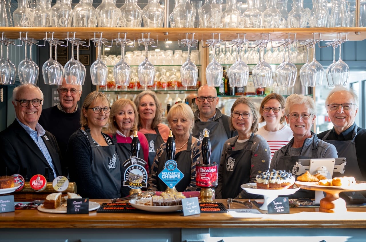 Pub is The Hub adviser Terry Stork celebrates community cafe with the Lion at Ickleton volunteers