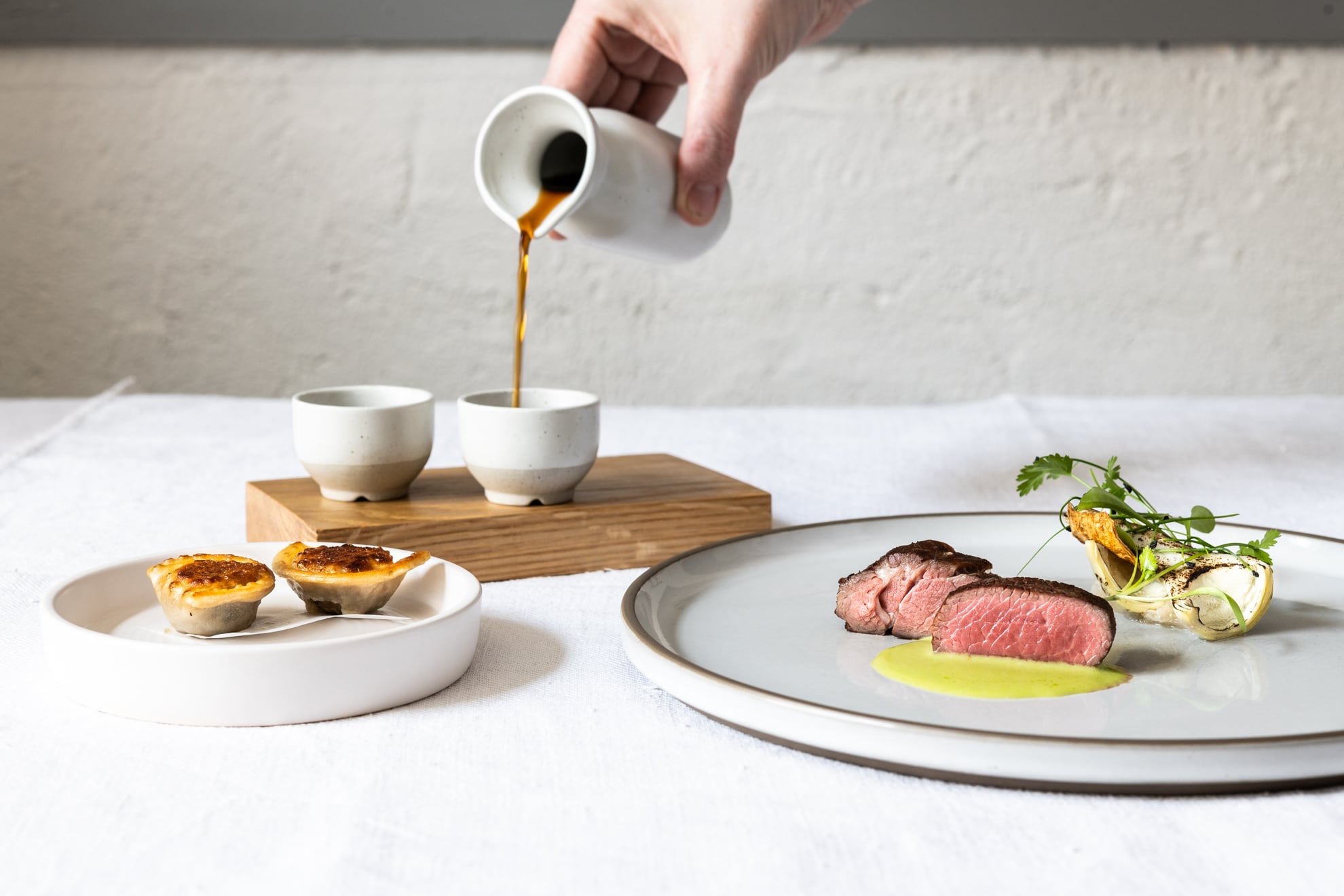 L-R Herdwick dumpling and broth, Town Head Farm Herdwick  hogget, violet artichoke, minted yow's curd credit Jenny Jones Photography