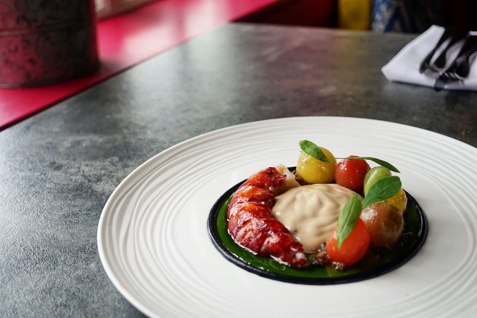 Dish Deconstruced: The Unruly Pig head chef Dave Wall, shares how to create lobster tail with warm tomato salad, black olive and burnt lemon