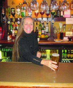 Janet.Dooner.serves.pint.at.the.Railway.Tavern.jpg