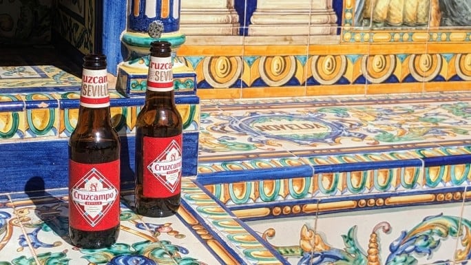 Cruzcampo beer in bottles on steps