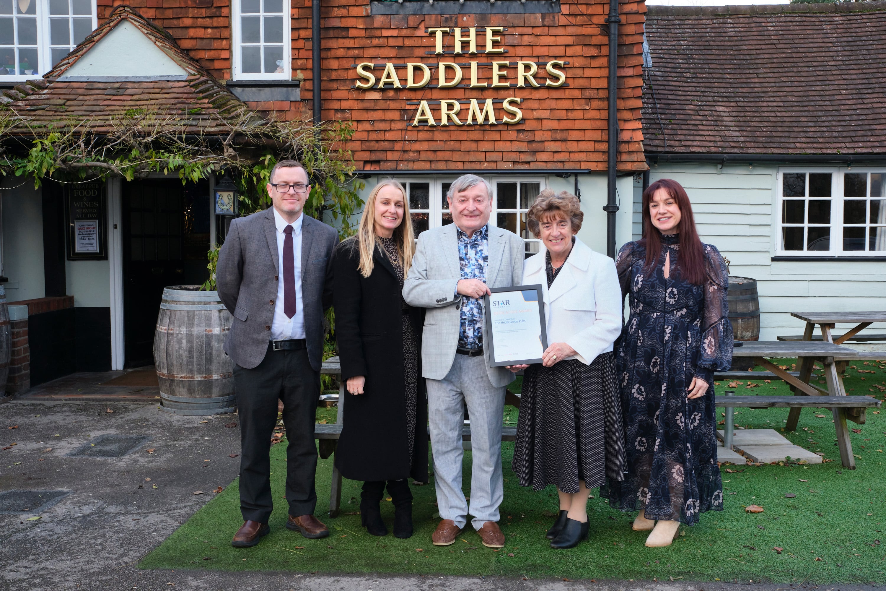 Donal and Marion Healy of the Saddlers Arms, Send, Surrey. Donal receives a Dedicated Service Award from Star Pubs