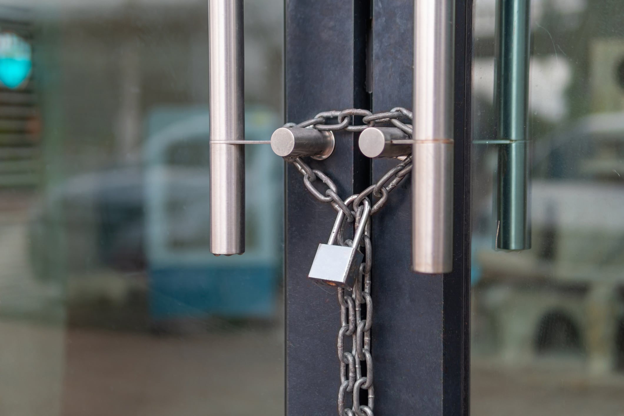 Door padlocked and chained shuts illustrates licensed premises closures in past year