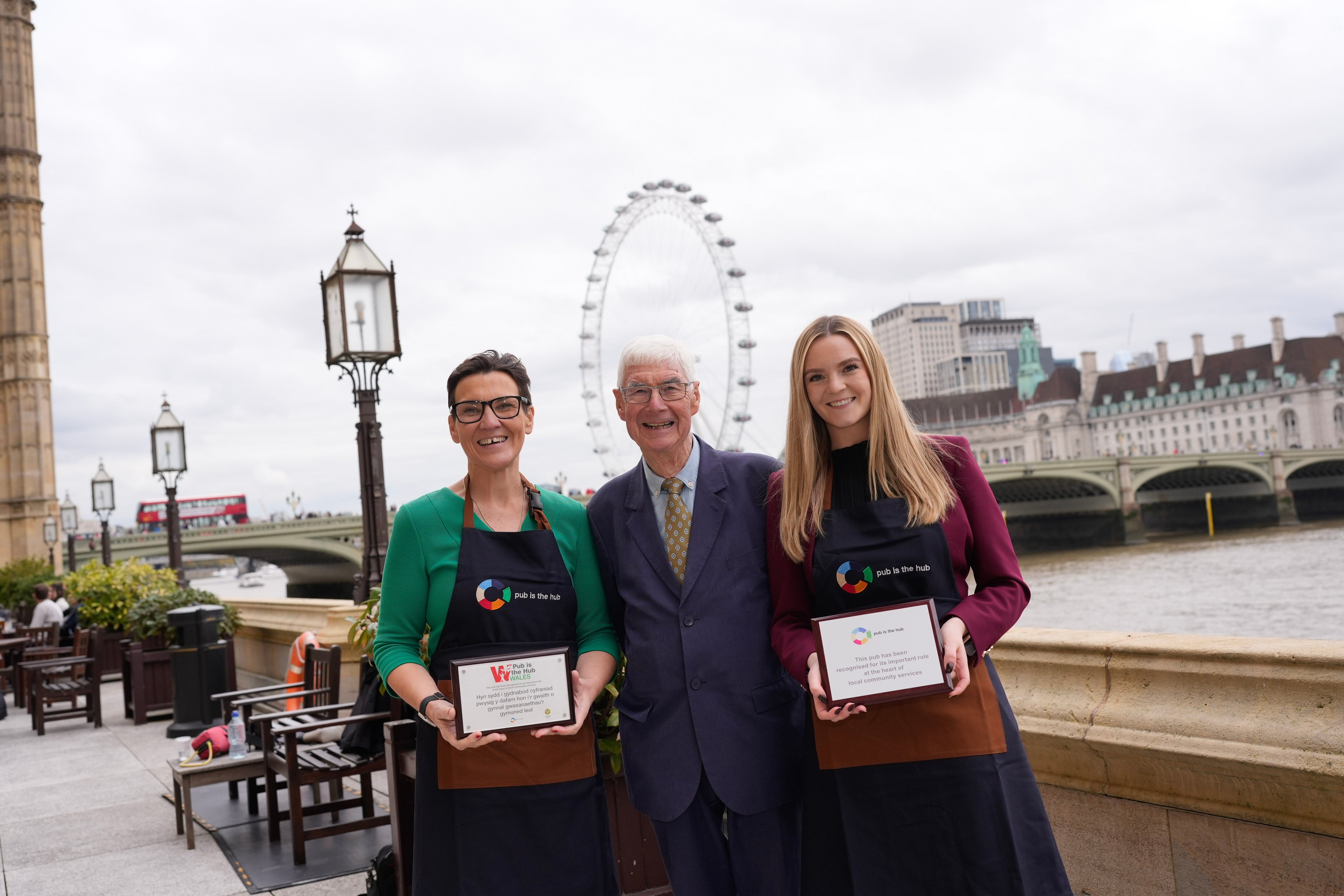 MP Tonia Antoniazzi, Pub is The Hub chief executive John Longden and employment rights and consumer protection minister Kate Dearden mark Government funding for rural pubs