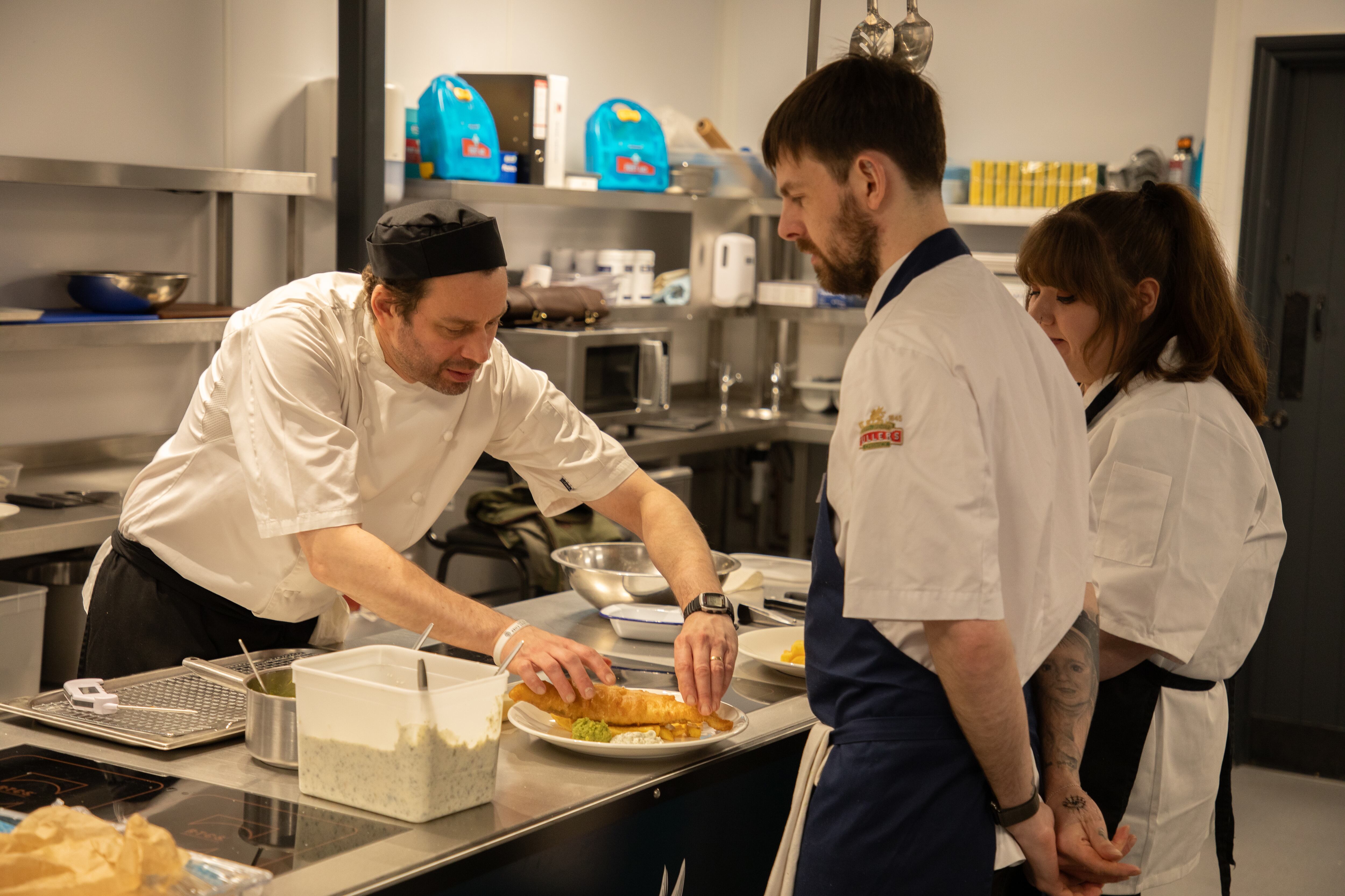 Luke Davies, chef skills training manager at Fuller’s Kitchen Academy with students