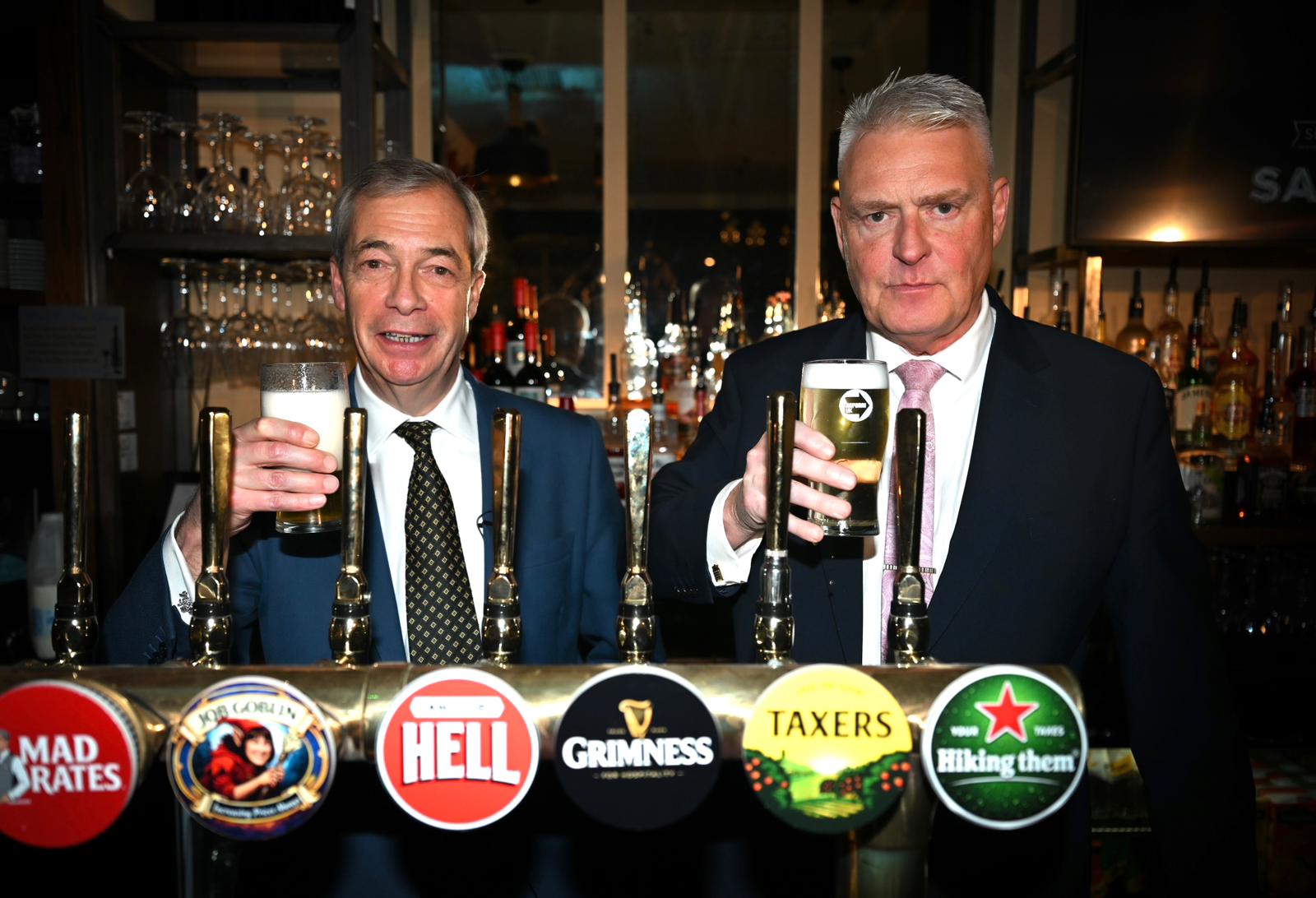 Nigel Farage and chief whip Lee Anderson with satirical tap badges