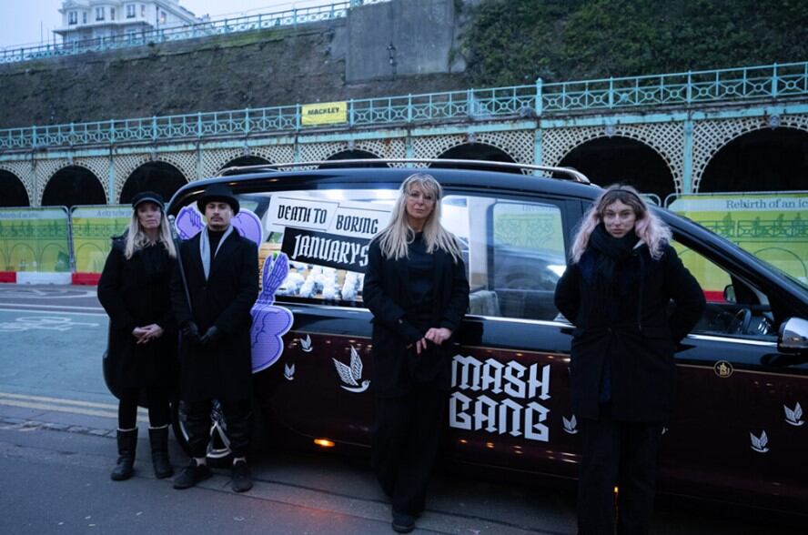 Mash Gang staff with hearse