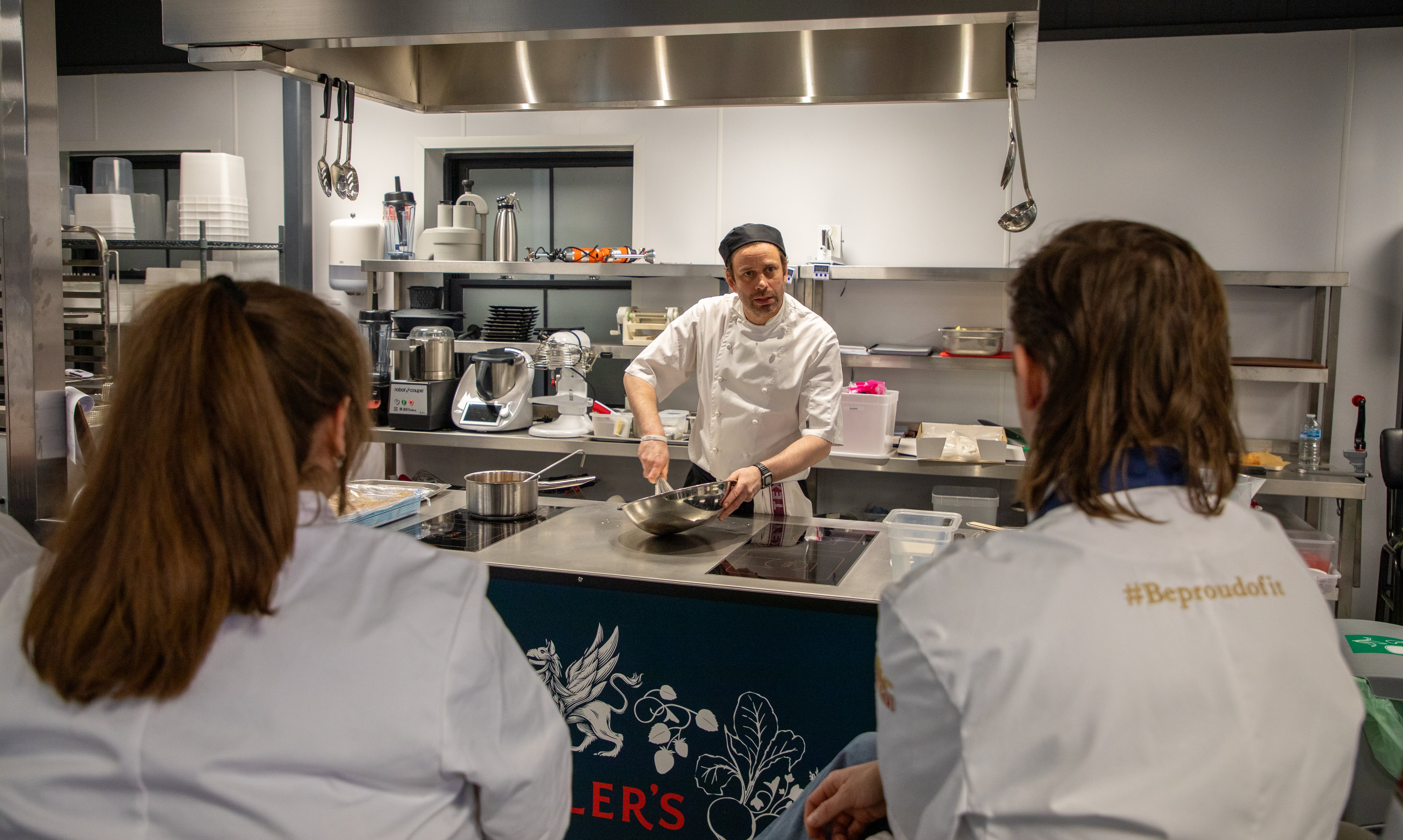 Luke Davies, chef skills training manager at Fuller’s Kitchen Academy with students