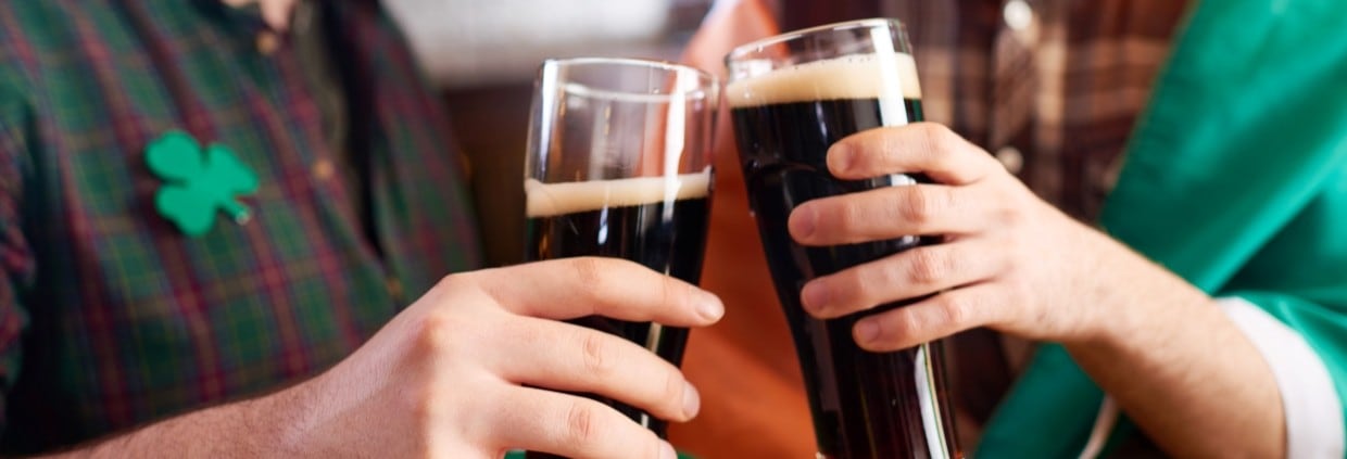Doing cheers with pints of stout