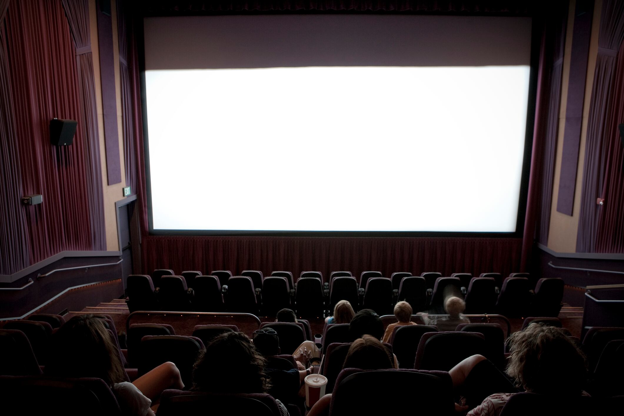 Small audience at local movie theater catching latest flick.