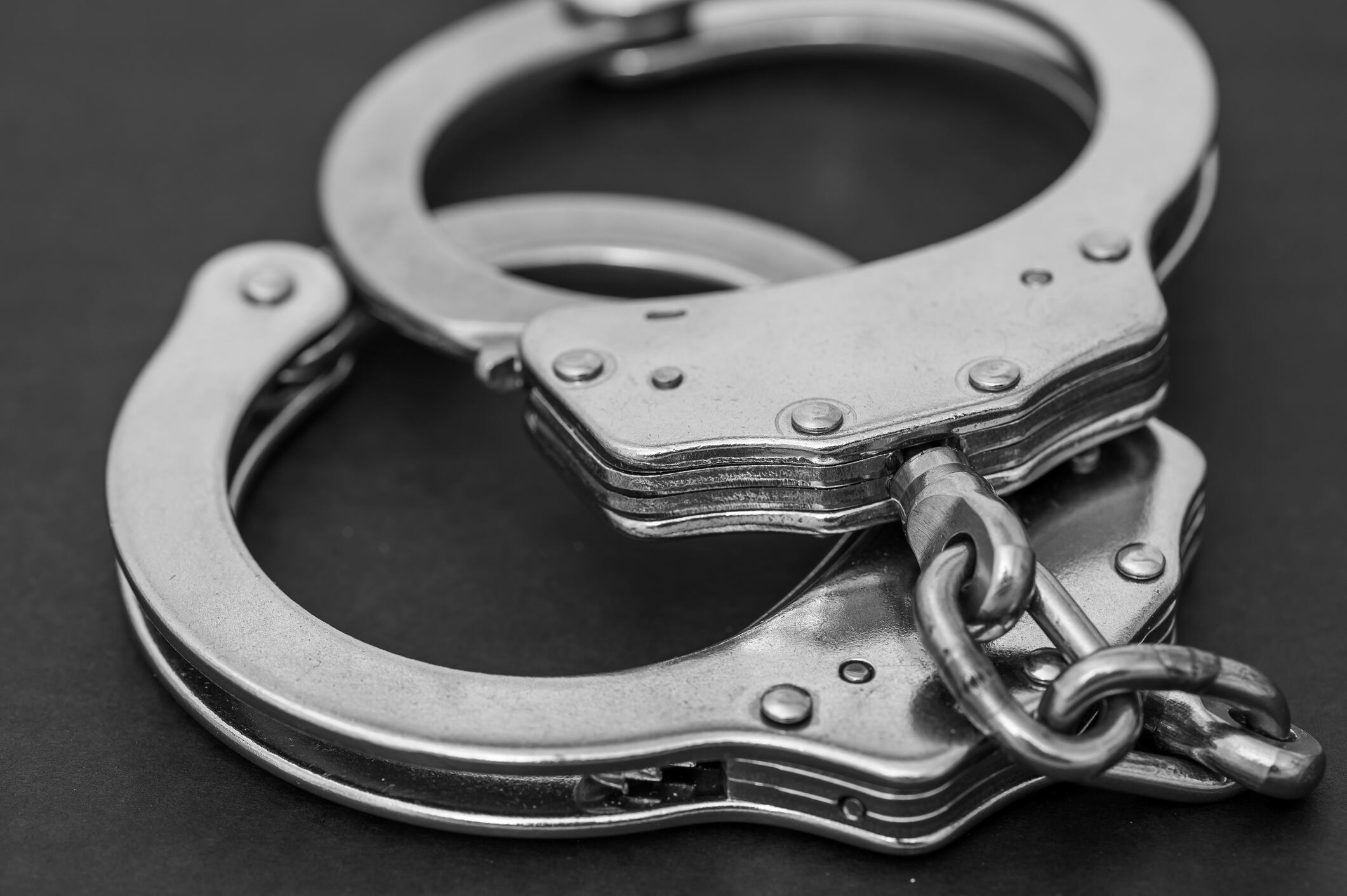 Justice concept, police handcuffs isolated