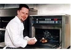 A chef in front of an oven