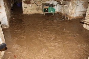 A water main blew a hole through the pub cellar's wall and filled the basement with water