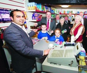 Pub shop: Jas Takhar, of the Red Lion, serves Clwyd West National Assembly member, Darren Millar, and young customers Caleb Dean and Ceri-Anne Cleaver