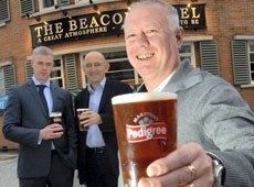 Jackson (L) and Whiteside (R) with licensee Gaskin (front) celebrate Pubs Week (Burton Mail)