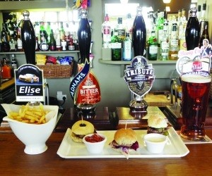 Snack time: The Horse & Jockey in Ravensden, Bedfordshire offers three mini-burgers with relishses and fries