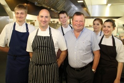 Head chef Matthew Mason (front left) and owner Paul Parnell (front right) and team