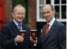 Michael Turner toasts results with finance director James Douglas