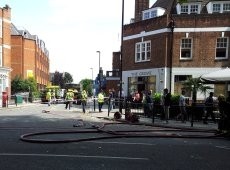 Clear-up operation: the aftermath of the riots in Ealing, west London