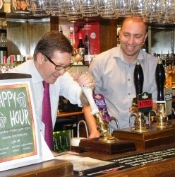 MP Mark Hunter steps behind the bar at the Victorian in Bramhall