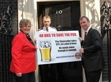 MP Nigel Evans (R) hands in petition to No 10
