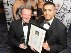 David Moorhouse collects the award from Khallid Saifullah of Business Link