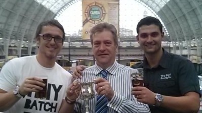 Award winning brewers Tiny Rebel pick up their award from CAMRA