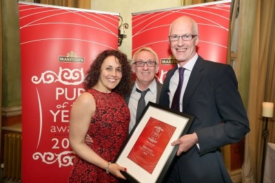 Licensees Tracy and Mike Kingston of The Feather's Inn in Lichfield receive their accolade from Peter Dalzell, MD of Marston’s Inns and Taverns (right)