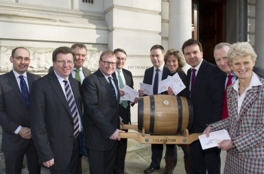 Special delivery: MPs and industry representatives take message in a barrel to Treasury 