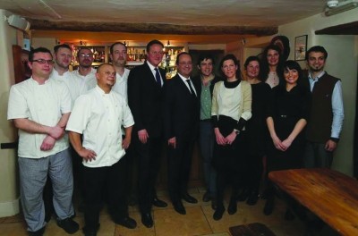 The team at the Swan Inn, Swinbrook with David Cameron and Francois Hollande