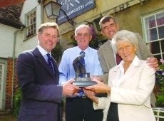 Happier times: Wadworth chairman Charles Bartholomew, left, with lessee John Glass, his wife, Judy, and son, Adam 