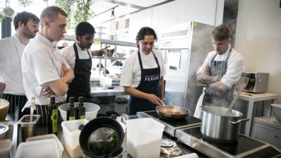 Francesco Mazzei (second from right) teaches the PCP chefs how to create an Italian dish