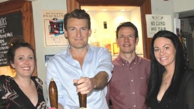 Brakspear chief: Tom Davies (second left) with members of the bar team at the Little Angel. Image courtesy of Henley Herald.