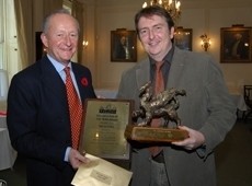 Fuller's chairman Michael Turner presents Chris Cochran with the Griffin Trophy
