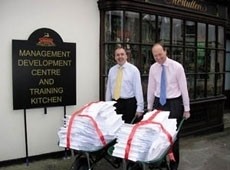 Furness-Smith (R) shows the weight of regulations with a barrow full of licensing applications