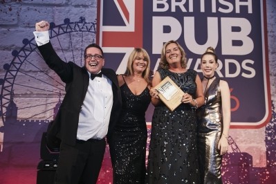 Winner: Simon Delaney celebrates victory at this year's Great British Pub Awards