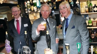 Cheers! HRH with licensee David Smith (l) and John Longden from Pub is the Hub