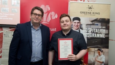 'Confidence boost': Jamie Quinn (right) collects his Get Into Hospitality certificate at an event in Leeds