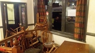 'Torn apart': Brawling football fans smashed windows and destroyed furniture at the Luckwell Hotel Pub in Bristol this weekend. (image: Frank Sprackman)