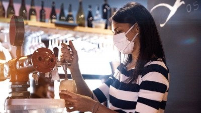 Lockdown easing: pub companies are waiting on updated Government guidance before deciding whether to encourage staff to continue wearing masks (image: Getty/LeoPatrizi)