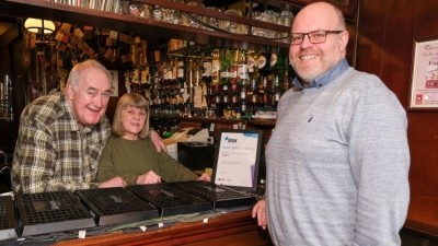 Long service award: Fagan's licensees Tom and Barbara Boulding pictured with Star Pubs & Bars’ area manager Anthony Lowther-Knowles 