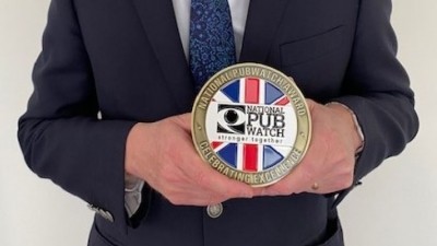 National Pubwatch chief executive Steve Baker OBE holding one of the new Pubwatch award trophies