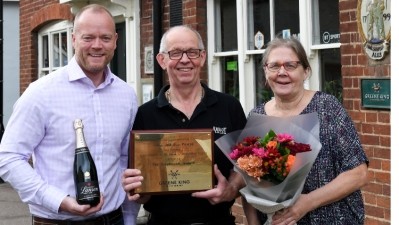 Monumental accomplishment: Colin and Sue Pearce (alongside Greene King Pub Partners managing director Wayne Shurvinton) celebrate 40-years at the Greyhound in Ixworth