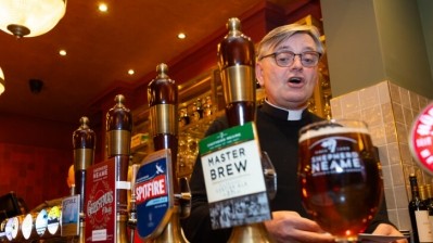 Holy spirit: The Dean of Rochester blesses the pub as it reopens